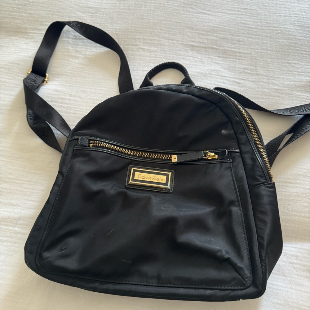 Calvin Klein black mini backpack.